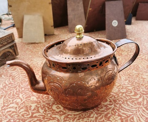Antique tea pot in copper