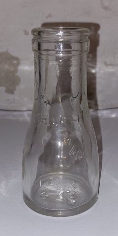 Lille flødeflaske i klart glas